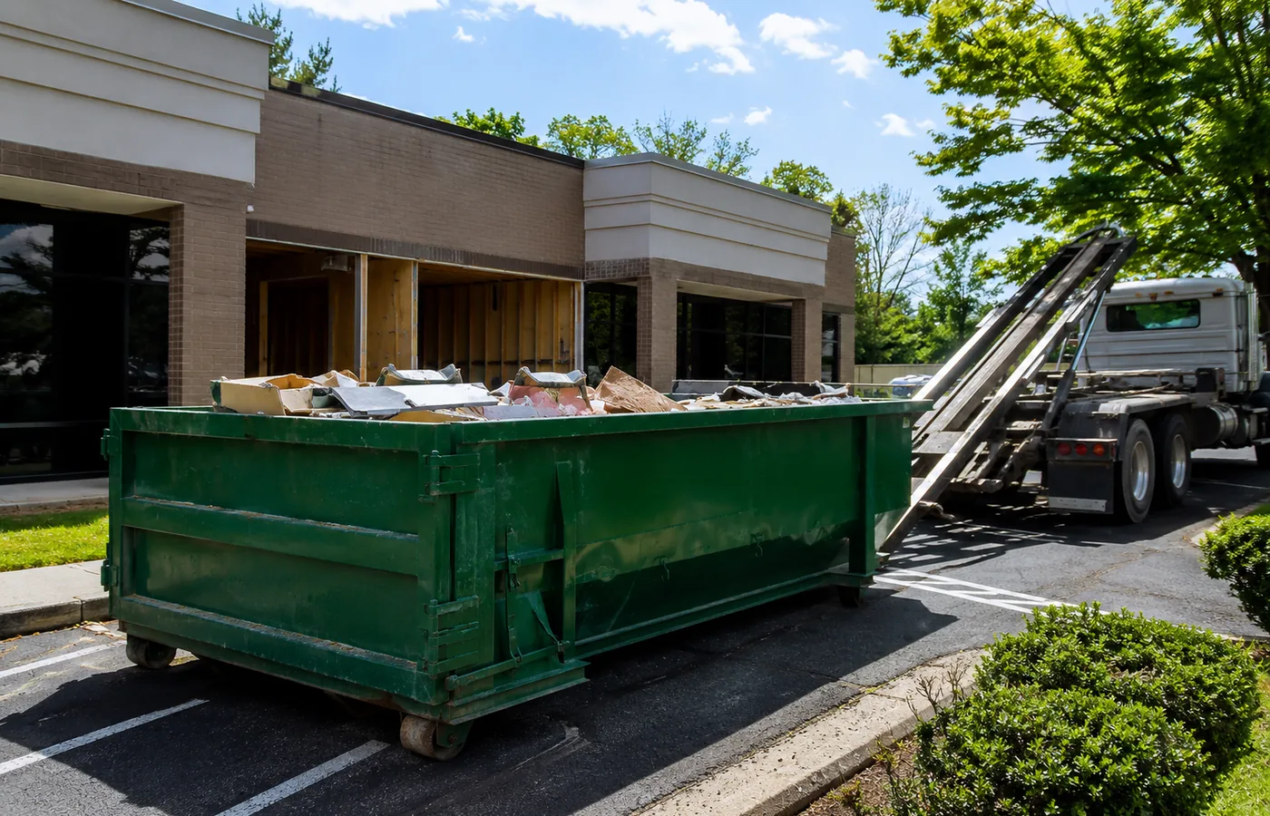 Roll-Off Dumpster in Cherry Creek - CO positioned beside a townhouse during an interior renovation, Roll-Off Dumpster in Englewood - CO set in a driveway during a residential renovation cleanup, Roll-Off Dumpster in Lakewood - CO positioned in a driveway during a residential renovation cleanup