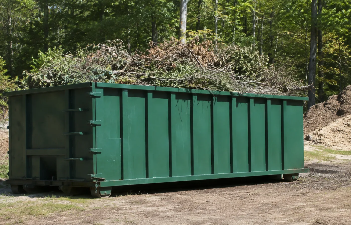 Roll-Off Dumpster in Highlands Ranch - CO set beside a home during a multi-room cleanout, Roll-Off Dumpster in Columbine - CO placed in a driveway during a home renovation cleanup