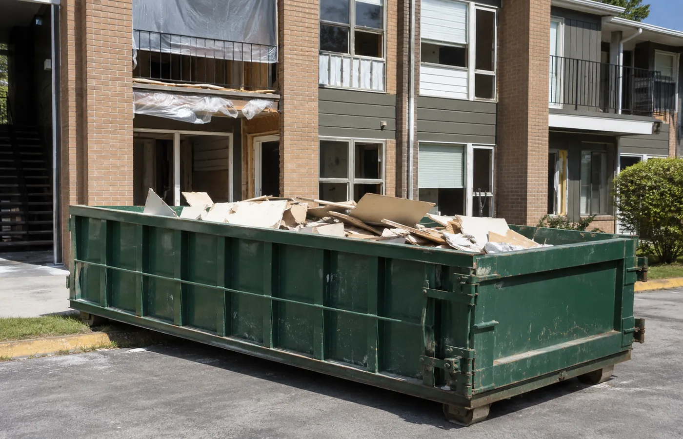 Roll-Off Dumpster in Parker - CO set beside a driveway as workers remove renovation debris, Roll-Off Dumpster in Cherry Hills Village - CO positioned beside a home during a remodeling cleanup